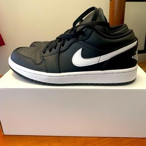 Size 8 Woman’s Black White Jordan 1s.